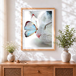Finished butterfly on cat nose cross stitch artwork displayed