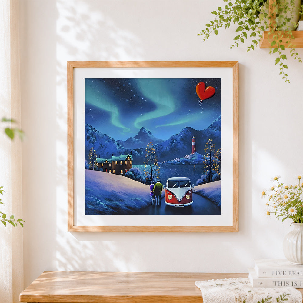 Finished camper van under northern lights cross stitch artwork displayed