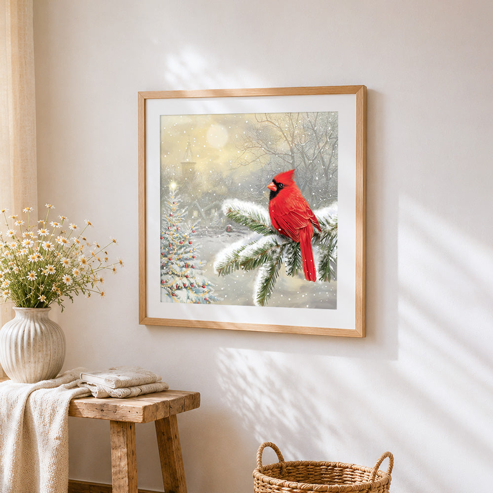 Cardinal bird in snow cross stitch artwork displayed on wall as home decor
