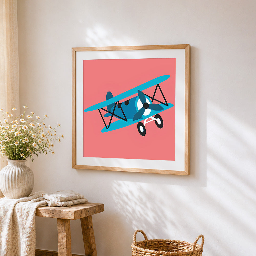 Cartoon blue biplane cross stitch artwork displayed on wall as home decor