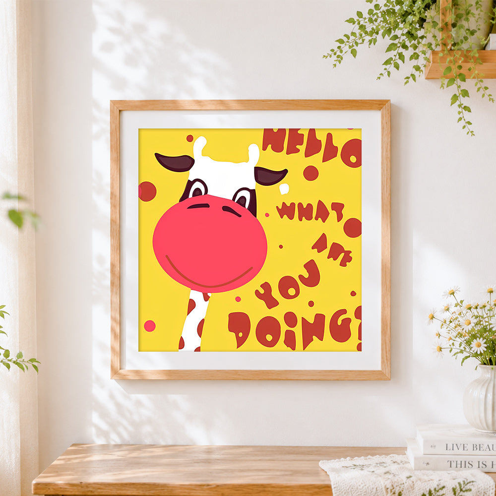 Finished cartoon cow greeting cross stitch artwork displayed