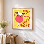 Cartoon cow greeting cross stitch artwork displayed on wall as home decor