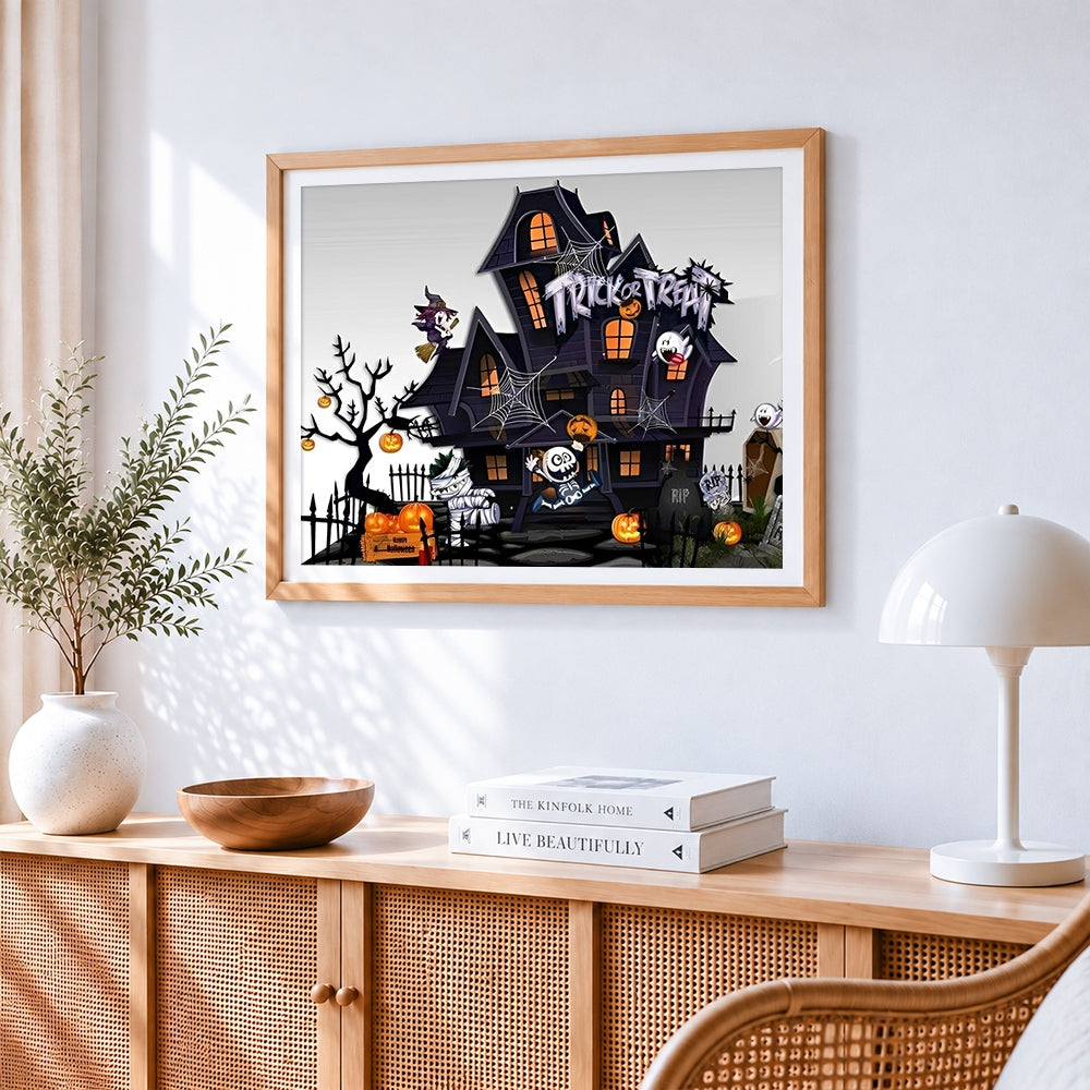 Cartoon haunted house trick or treat cross stitch artwork displayed on wall as home decor