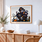 Cartoon haunted house trick or treat cross stitch artwork displayed on wall as home decor