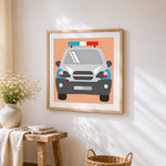 Cartoon police car cross stitch artwork displayed on wall as home decor