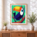 Finished cartoon tropical toucan cross stitch artwork displayed