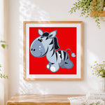 Finished cartoon zebra on red background cross stitch artwork displayed
