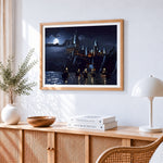 Castle at night cross stitch artwork displayed on wall as home decor