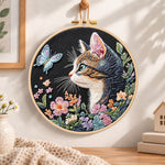 Cat and blue butterfly embroidery hoop wall art displayed as warm and cosy handmade home decor