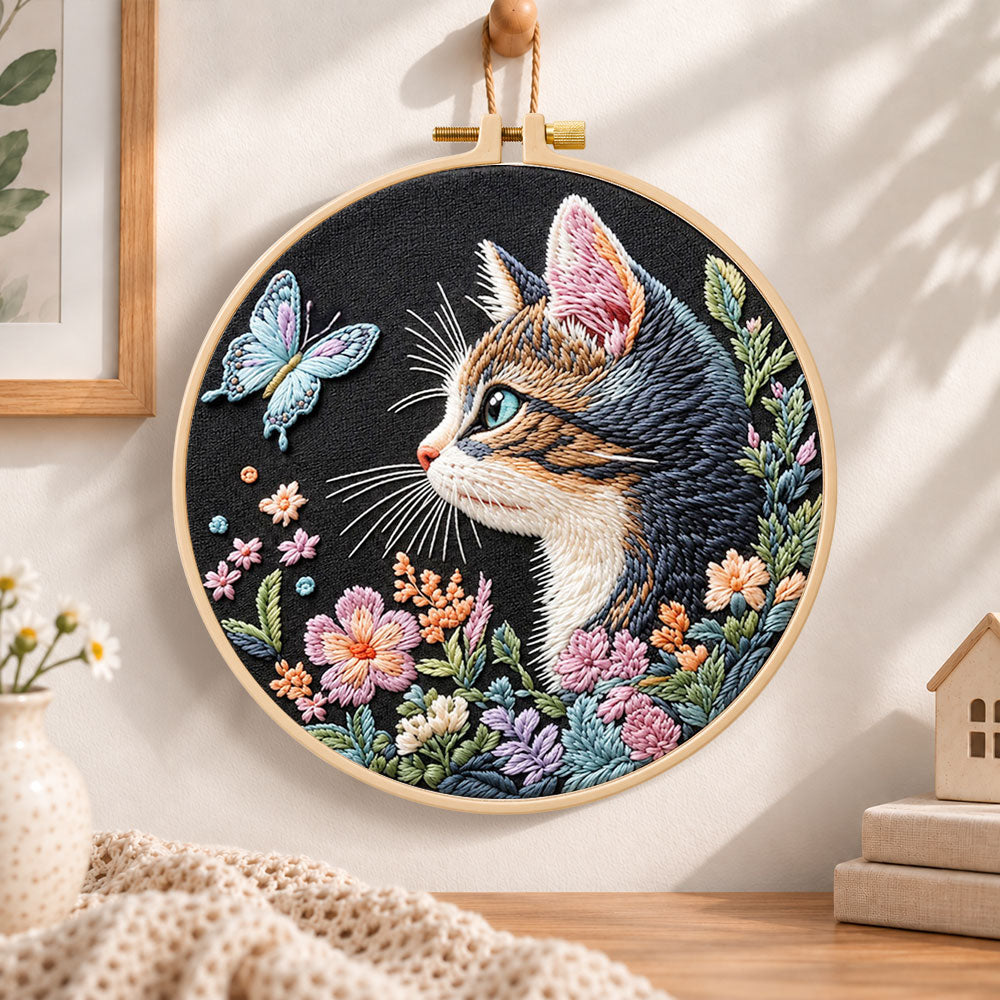 Cat and blue butterfly embroidery hoop wall art displayed as warm and cosy handmade home decor