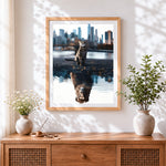 Finished cat and lion reflection cross stitch artwork displayed