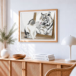 Cat and tiger in mirror cross stitch artwork displayed on wall as home decor