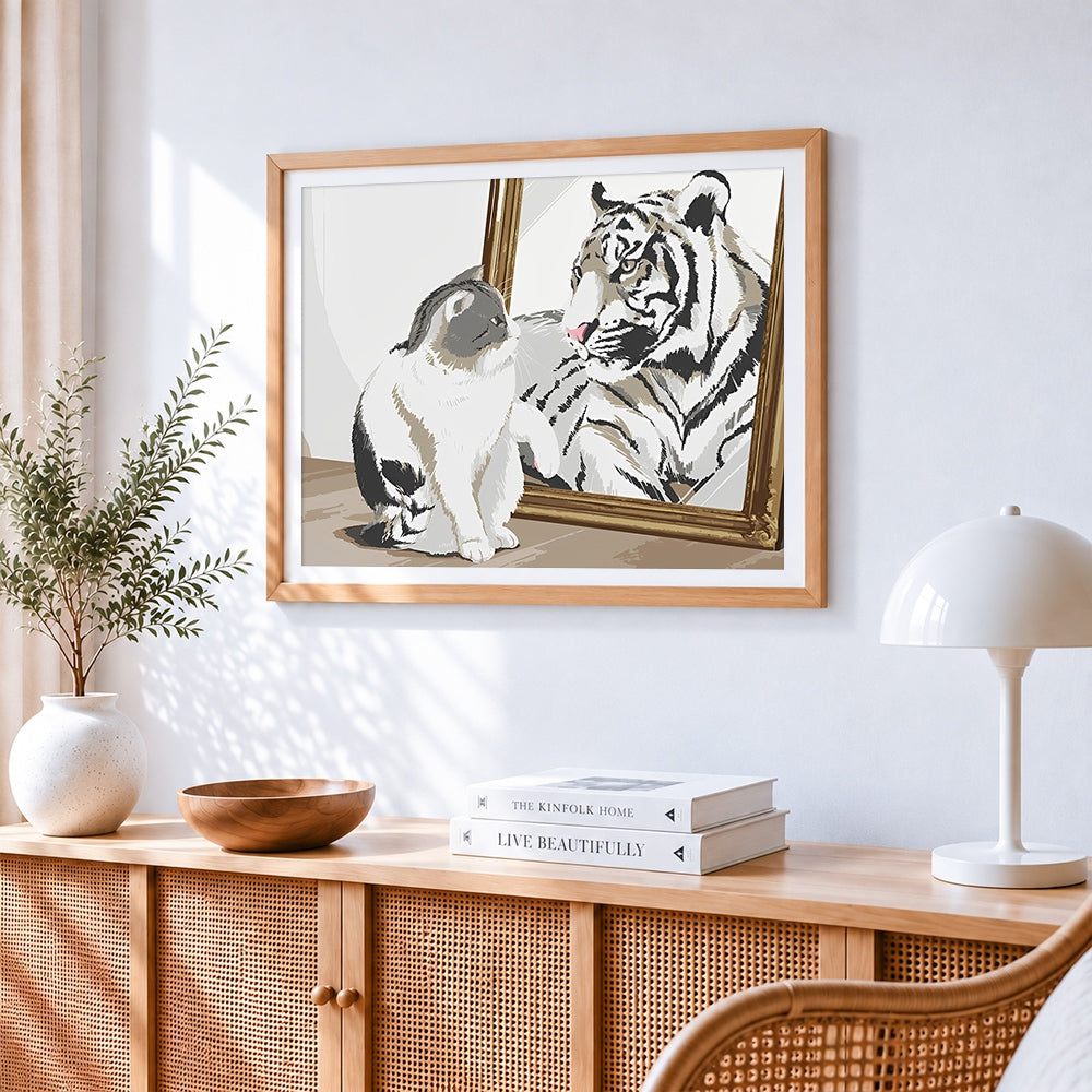 Cat and tiger in mirror cross stitch artwork displayed on wall as home decor