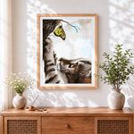 Finished cat and yellow butterfly cross stitch artwork displayed