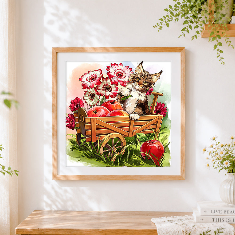 Finished cat in apple cart cross stitch artwork displayed