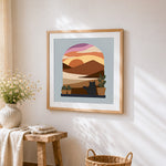 Cat in arch window sunset cross stitch artwork displayed on wall as home decor
