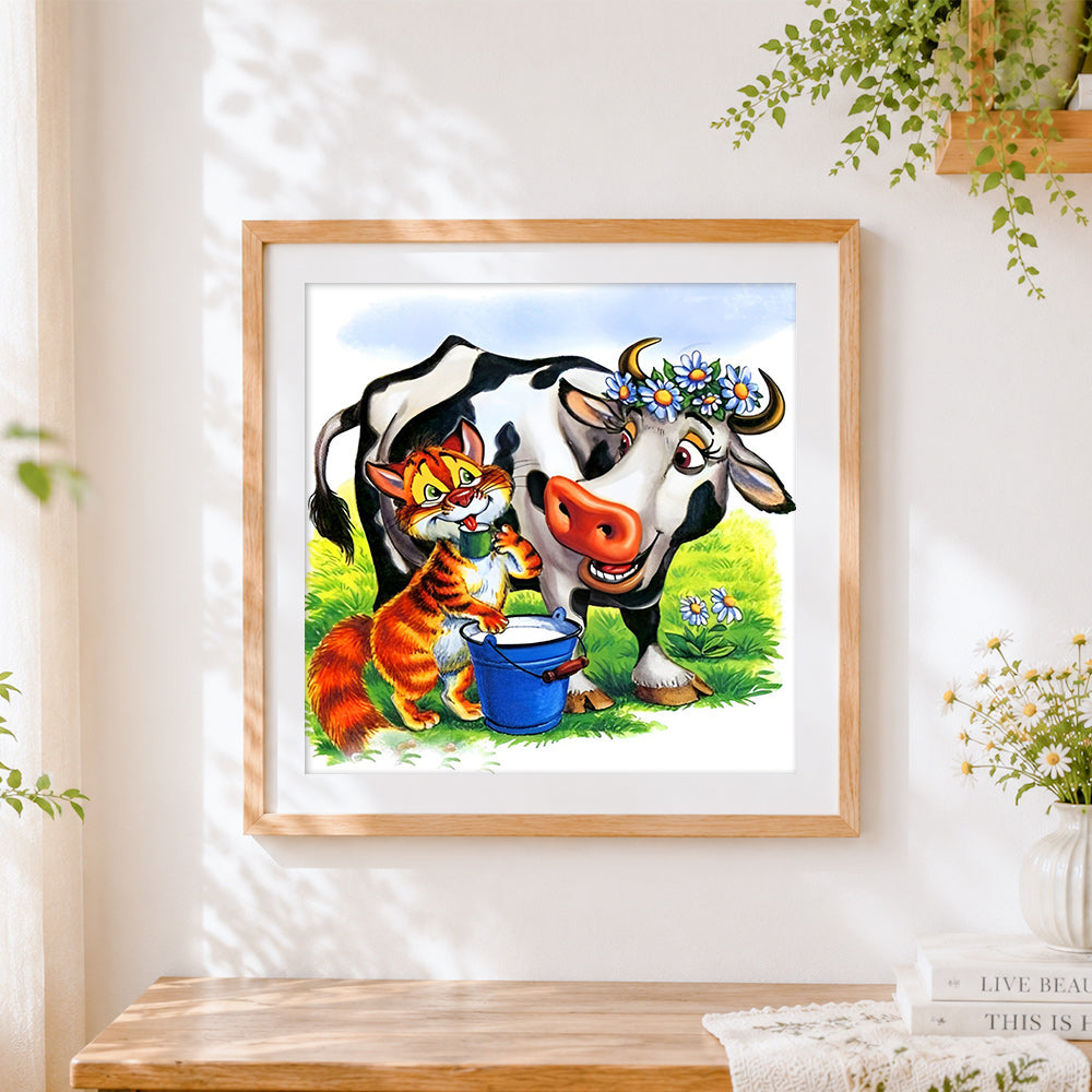 Finished cat milking a cow cross stitch artwork displayed
