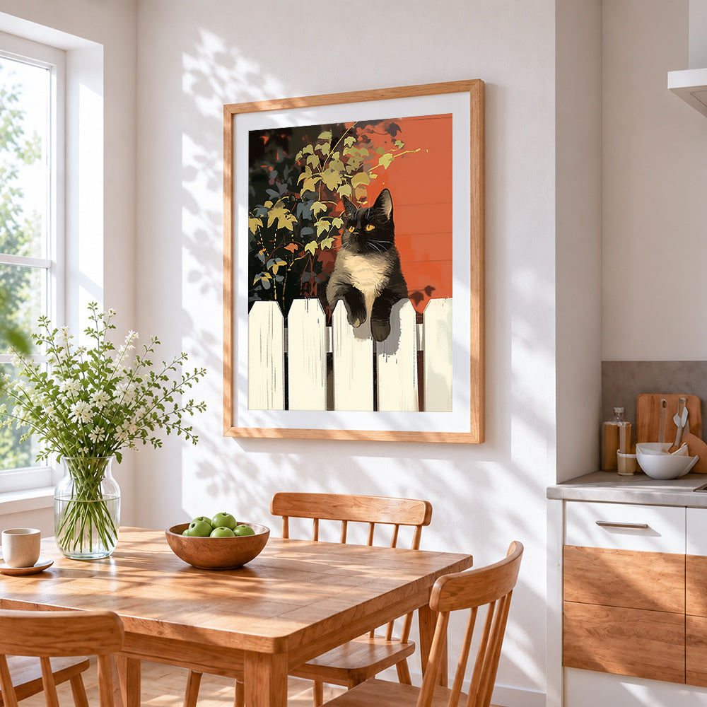Cat on a white picket fence cross stitch artwork displayed on wall as home decor