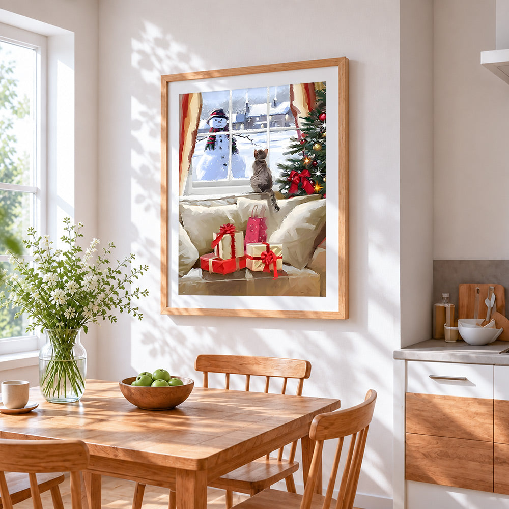 Cat on a windowsill watching a snowman outside cross stitch artwork displayed on wall as home decor