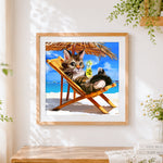 Finished cat relaxing on beach holiday cross stitch artwork displayed