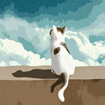 Cat sitting under white clouds cross stitch kit for beginners