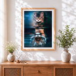 Finished cat to tiger reflection cross stitch artwork displayed