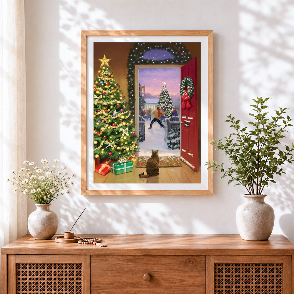 Finished cat watching snowball fight cross stitch artwork displayed