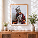 Finished cat wearing a shawl cross stitch artwork displayed
