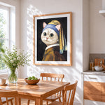 Cat with a pearl earring cross stitch artwork displayed on wall as home decor