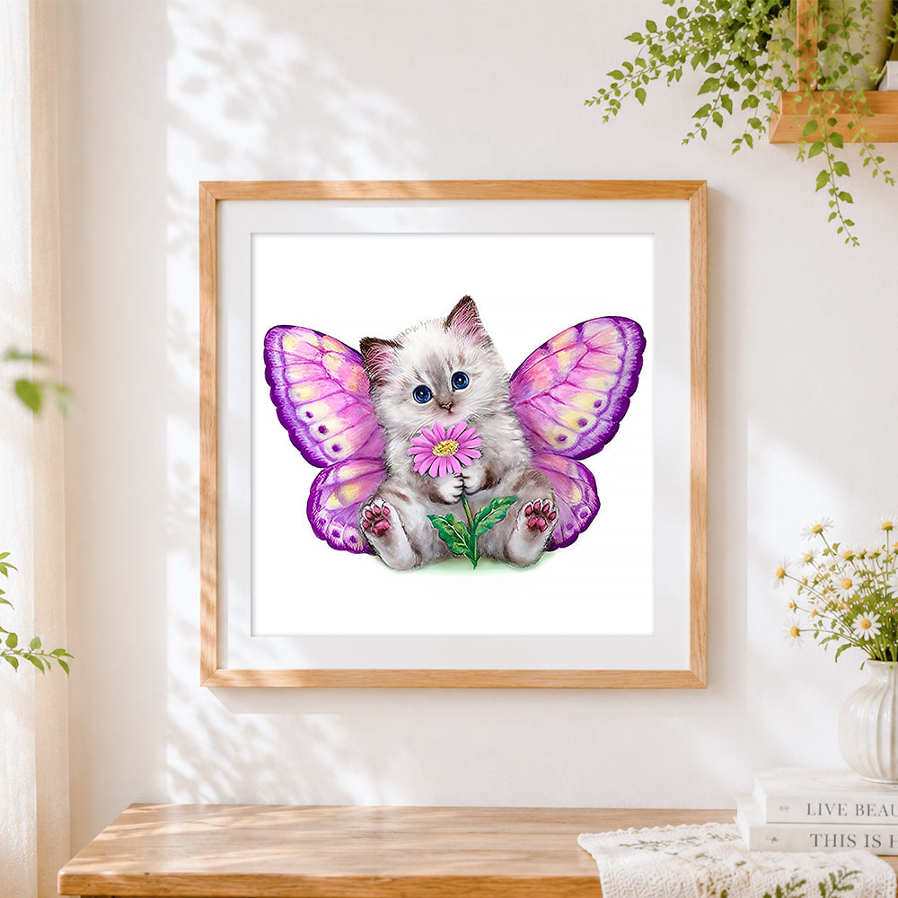 Finished cat with butterfly wings cross stitch artwork displayed