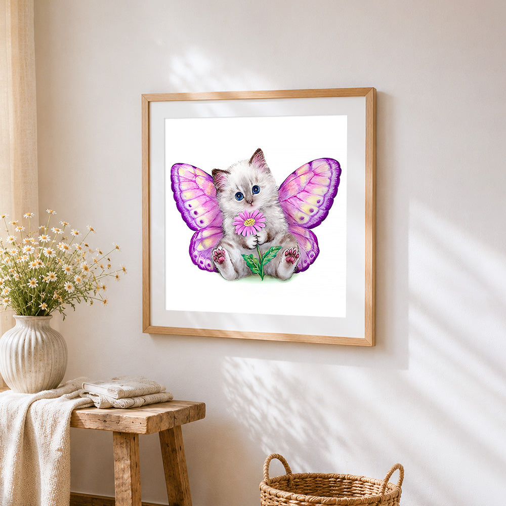 Cat with butterfly wings cross stitch artwork displayed on wall as home decor