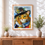 Finished cat with feather hat cross stitch artwork displayed