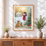 Finished cats watching a snowman from a christmas window cross stitch artwork displayed