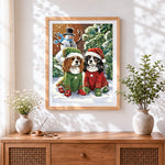 Finished cavalier king charles spaniels in christmas jumpers cross stitch artwork displayed