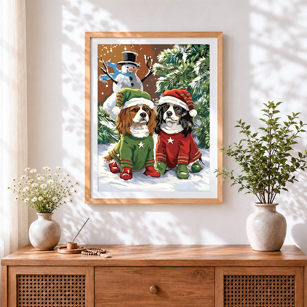 Finished cavalier king charles spaniels in christmas jumpers cross stitch artwork displayed