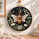 Celestial bee with daisies embroidery hoop wall art displayed as warm and cosy handmade home decor