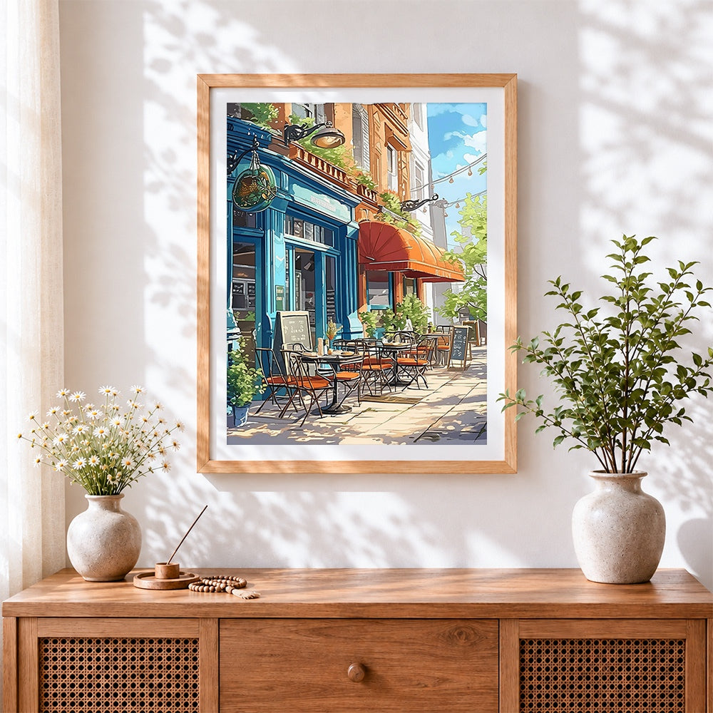 Finished charming blue cafe on a sunny street cross stitch artwork displayed