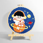 Charming space boy on orange planet punch needle kit for beginners