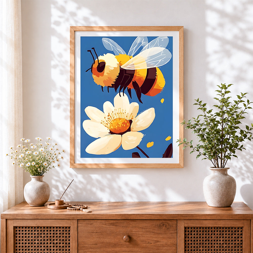 Finished cheerful bumblebee and white blossom cross stitch artwork displayed
