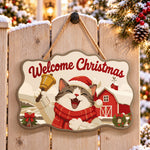Cheerful cat with christmas bell paint by numbers door hanger on a garden gate