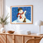 Cheerful snowman with broom cross stitch artwork displayed on wall as home decor