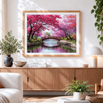 Finished cherry blossom bridge cross stitch artwork displayed