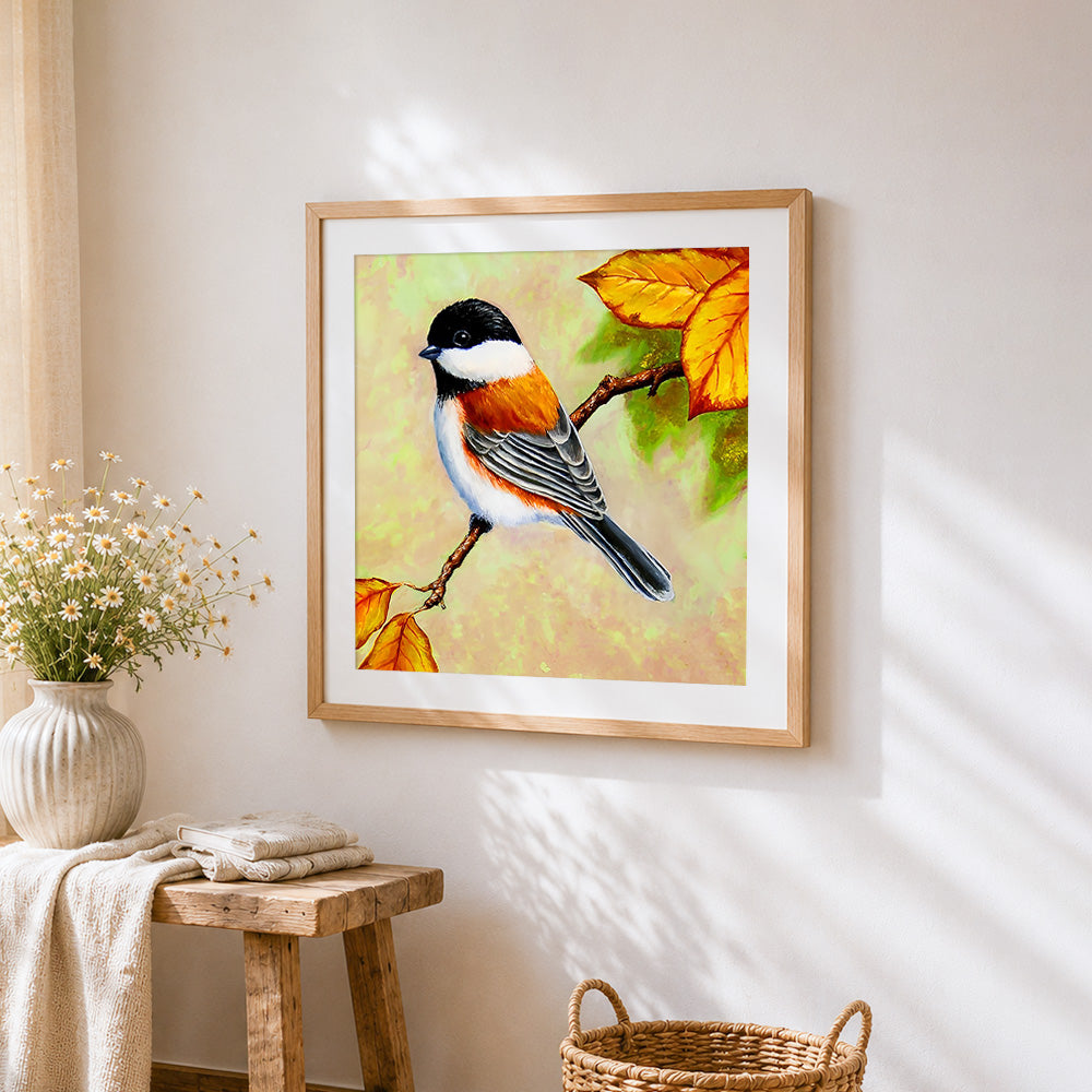 Chickadee on autumn branch cross stitch artwork displayed on wall as home decor