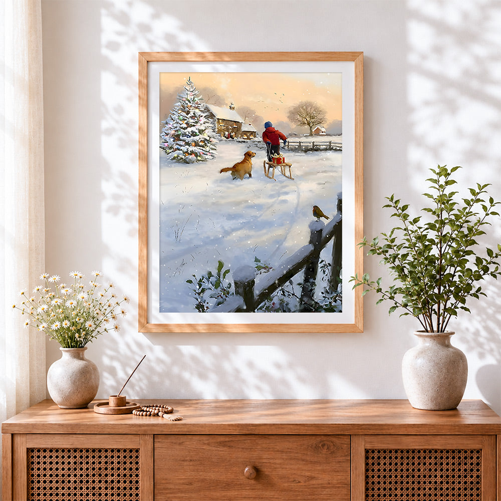 Finished child pulling a sleigh with a golden retriever cross stitch artwork displayed