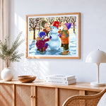 Children building a snowman in winter cross stitch artwork displayed on wall as home decor