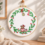 Christmas bear wreath embroidery hoop wall art displayed as warm and cosy handmade home decor