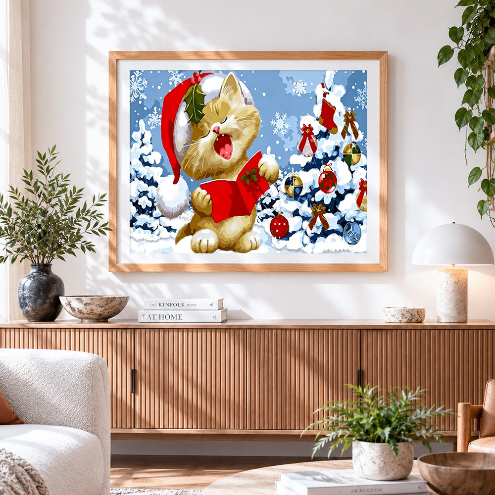 Finished christmas cat singing carols in the snow cross stitch artwork displayed
