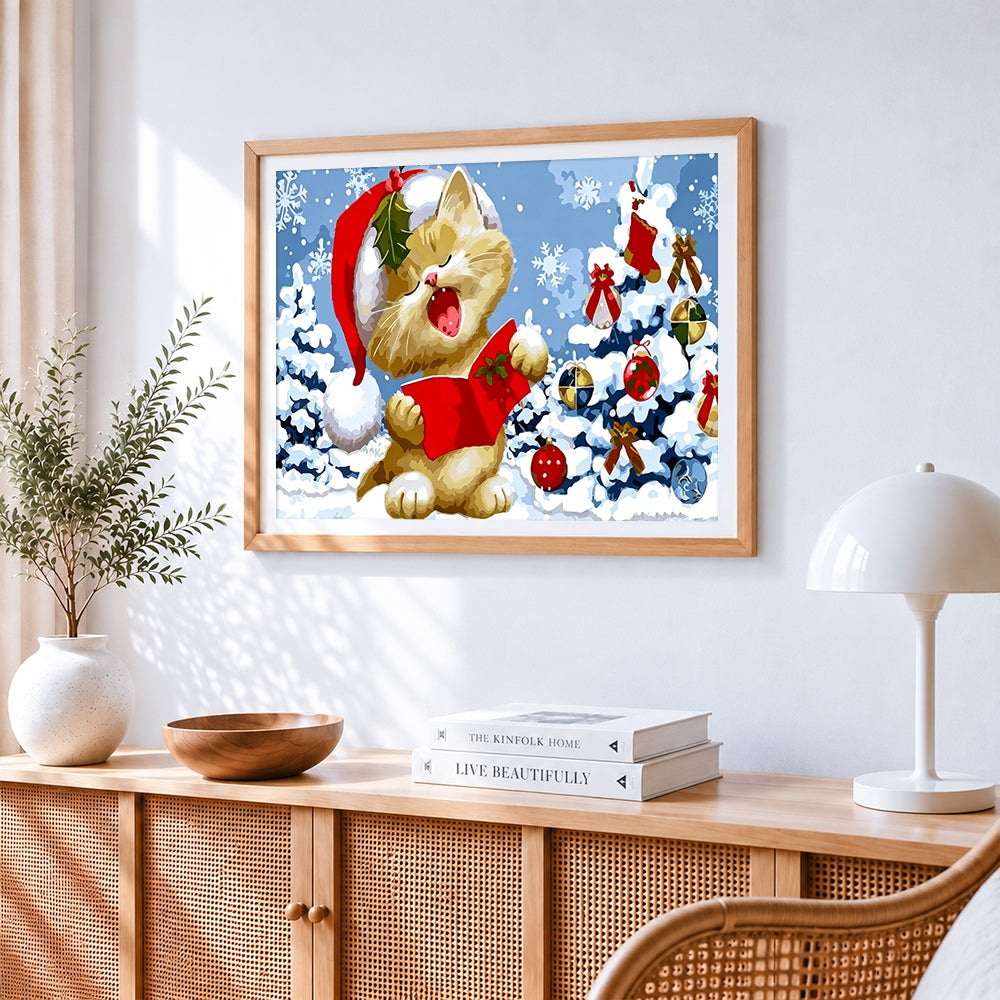 Christmas cat singing carols in the snow cross stitch artwork displayed on wall as home decor