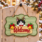 Christmas cat welcome paint by numbers door hanger on a garden gate