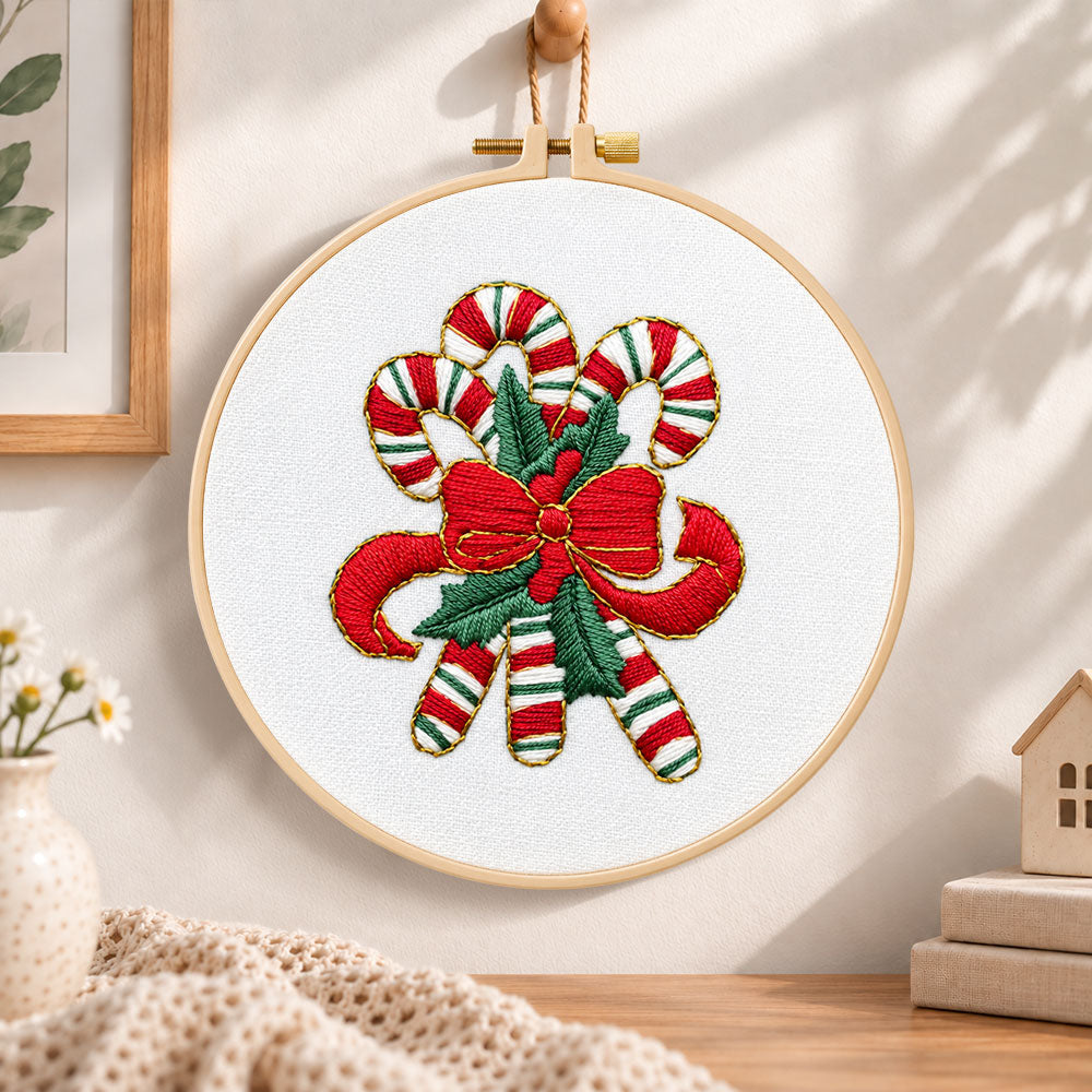 Christmas striped candy cane embroidery hoop wall art displayed as warm and cozy handmade home decor